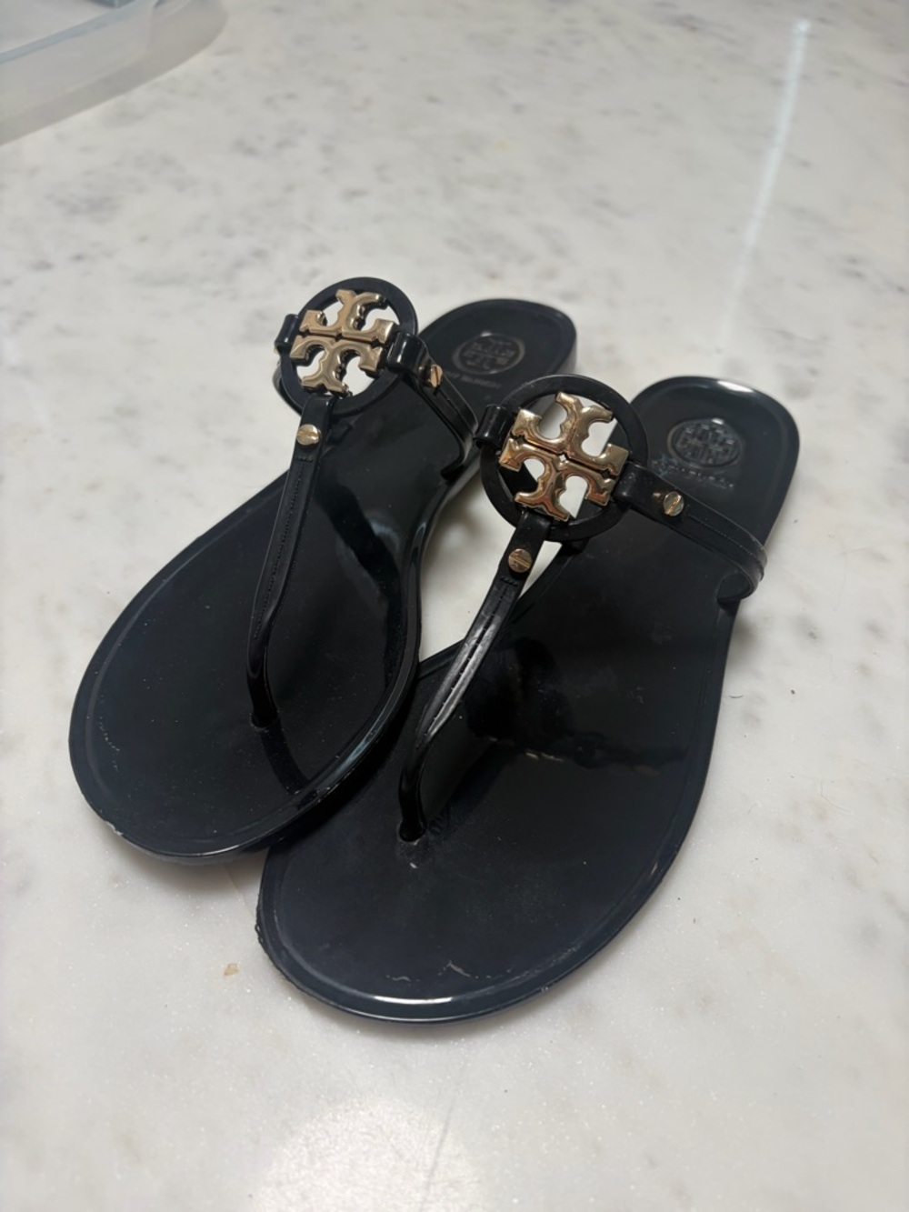 Tory Burch Black Jelly Thong Sandals with Gold Logo Medallion